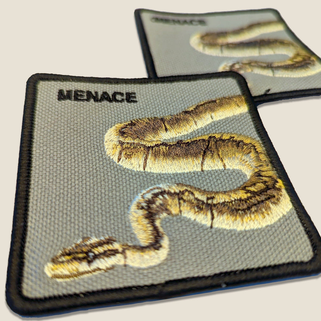 Snake embroidered patches with merrowed edges